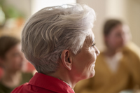 A woman wearing a Resound Nexia hearing aid.