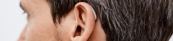 Someone wearing a Signia hearing aid.