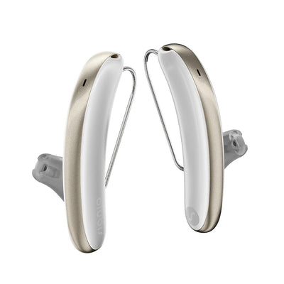 A pair of Signia Styletto IX 7 kit hearing aids in white and fine gold.
