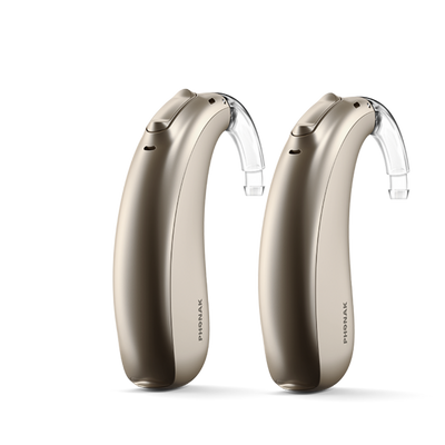 A pair of Phonak Lumity Naida P90 hearing aids champagne.
