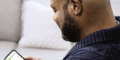 Someone wearing a Phonak Naida hearing aid.